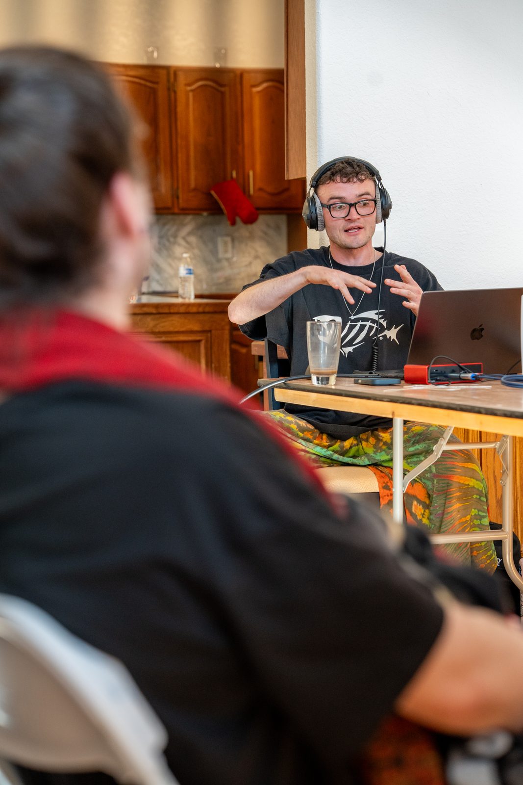 Student explaining a track with headphones